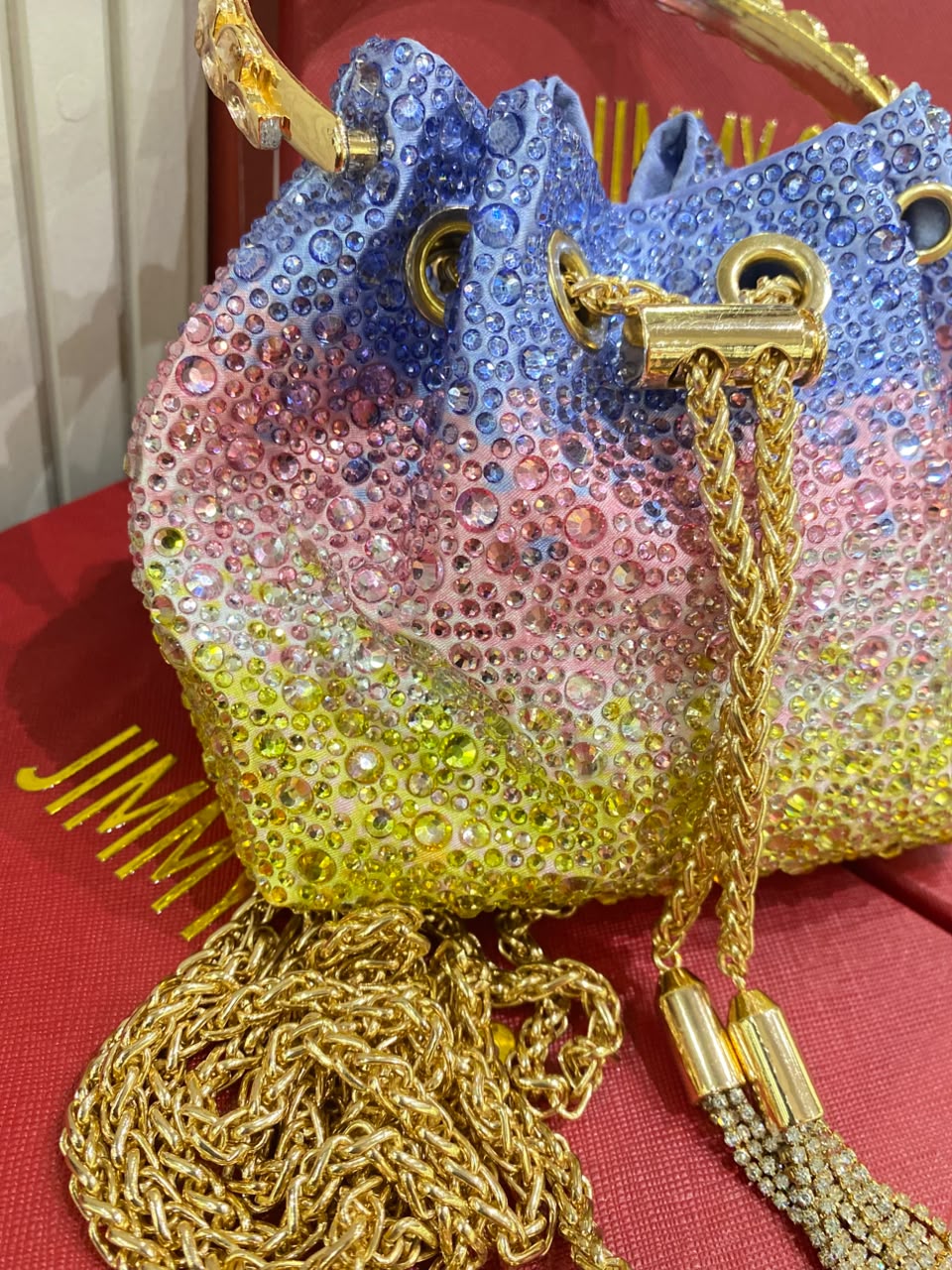 J-I-M-M-Y C-H-O-O Bon Bon Deep Merlot Satin & Crystal Hotfix Bucket Bag (Blue with Multi Colors)