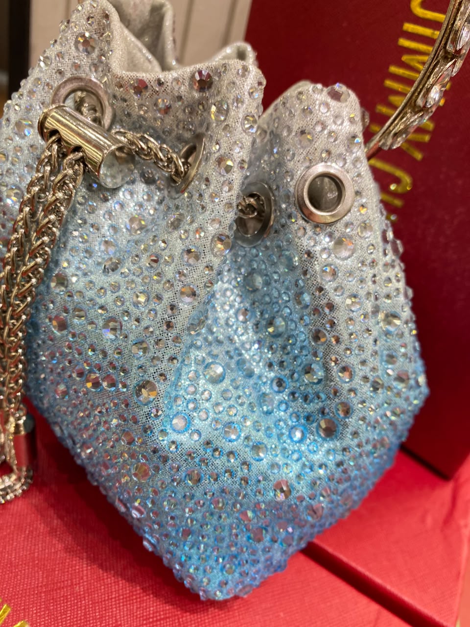 J-I-M-M-Y C-H-O-O Bon Bon Deep Merlot Satin & Crystal Hotfix Bucket Bag (Sky Blue)