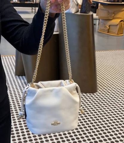 C-O-A-C-H Faye Mini Drawstring Bag – Elegant Luxe Women Bag (White)