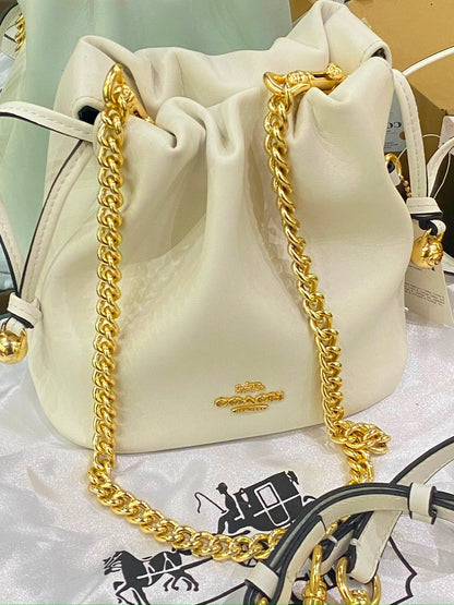 C-O-A-C-H Faye Mini Drawstring Bag – Elegant Luxe Women Bag (White)