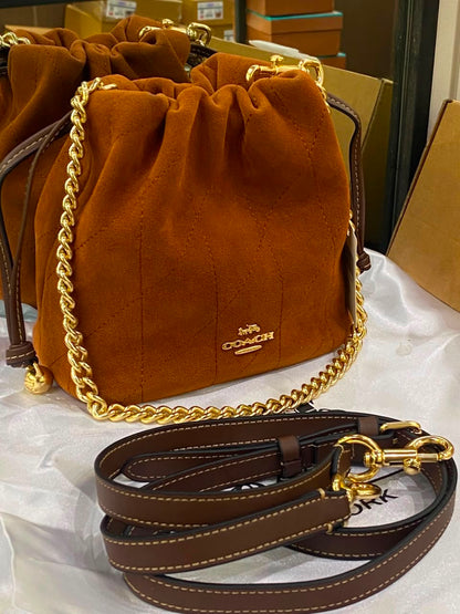 C-O-A-C-H Faye Mini Drawstring Bag – Elegant Luxe Women Bag (Brown)