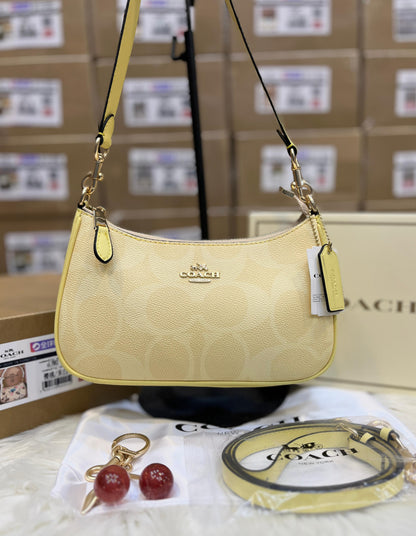 C-O-A-C-H Teri Shoulder Women Bag in Signature Canvas (Yellow Beige)
