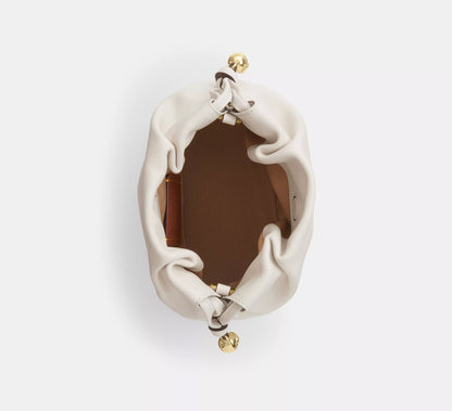 C-O-A-C-H Faye Mini Drawstring Bag – Elegant Luxe Women Bag (White)