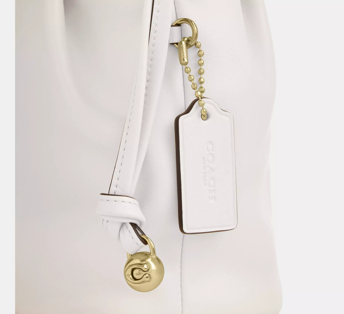 C-O-A-C-H Faye Mini Drawstring Bag – Elegant Luxe Women Bag (White)