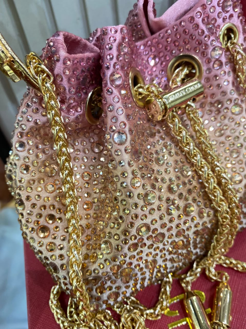 J-I-M-M-Y C-H-O-O Bon Bon Deep Merlot Satin & Crystal Hotfix Bucket Bag (Pink Gold)
